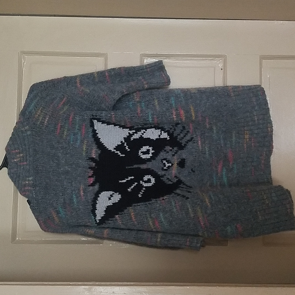 Cat on the back of cardigan